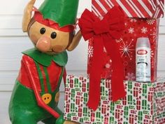 a wooden toy sitting next to a pile of presents