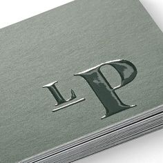 the letter p is placed on top of several stacks of cards that are stacked together