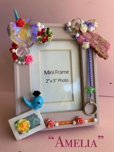 the frame is decorated with flowers, beads and other things to decorate on top of it