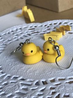 two yellow rubber ducks sitting on top of a table