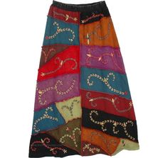 Old School Patchwork Skirt with Embroidery in Heavy Fabric. Exotic masterpiece hand embroidery is what this skirt stand out for. Made of very heavyweight cotton, these patchwork skirts are ideal to wear during fall and winters. This skirt has rich patchwork and beautiful multi-color `thick-thread` embroidery on the front. The back of the skirt is solid stonewashed black-brown, no embroidery. This is a limited-flare stone-wash look skirt (A-line) with panels of teal, red, orange, brown, black etc Long Embroidered Cotton Skirt, Embroidered Cotton Skirt, Bohemian Multicolor Skirt With Floral Embroidery, Multicolor Bohemian Skirt With Floral Embroidery, Bohemian Cotton Bottoms With Multicolor Embroidery, Embroidered Multicolor Skirt For Festivals, Multicolor Embroidered Skirt For Festivals, Bohemian Multicolor Embroidered Skirt, Festival Long Skirt With Embroidery