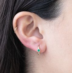 Elevate your earring stack with our exquisite gold huggies with the May birthstone - emerald! These stunning emerald hoops are featured in a solid 14k gold bezel setting. Designed for conch piercings, helix piercings, and most other cartilage piercings, these versatile huggie earrings add a touch of glamour and elegance to any ensemble, making them a perfect choice for those born in May or anyone looking to make a stylish statement in green.Item Details• Material: 14k Solid Yellow Gold• Gemstone Sterling Silver Huggie Earrings With Birthstone, 14k Gold Huggie Earrings With Bezel Setting, Everyday Huggie Earrings With Bezel Setting, Gift Huggie Hoop Earrings With Bezel Setting, 14k Gold Huggie Birthstone Earrings, Everyday Yellow Gold Huggie Earrings With Birthstone, 14k Gold Internally Threaded Huggie Earrings, Diamond Cleaner, Conch Piercings