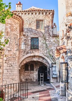 an old stone building with arched doorways