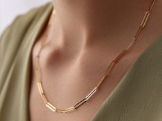 🌟 14K Gold Paperclip Chain Necklace 🌟 Make a modern statement with our 14K Gold Paperclip Chain Necklace. This stylish piece features elongated, rectangular links, giving it a contemporary and sleek look. Perfect for layering or wearing on its own, the paperclip chain adds a touch of minimalist elegance to any outfit. Its lightweight yet bold design makes it a versatile accessory that complements both casual and formal styles. ✨ Available in three gorgeous colors--classic yellow gold, warm ros Luxury Paperclip Necklace For Women, Chic Gold-plated Paperclip Chain Necklace, Modern Gold-plated Paperclip Chain Necklace, Luxury Gold-plated Paperclip Chain Necklace, Elegant Gold-tone Paperclip Necklace, Gold-tone 14k Gold Necklace With Paperclip Chain, Gold Necklace For Women, Paperclip Chain Necklace, Dramatic Style