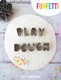 a cake with the words play dough spelled in frosting