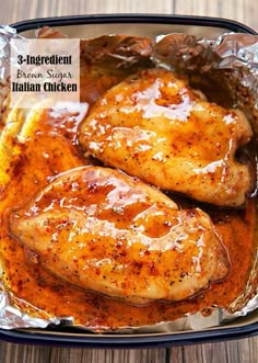 two pieces of chicken covered in gravy on top of tin foil with the words, 3 ingredient italian chicken