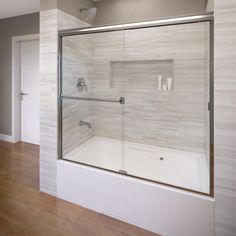 a bathroom with a glass shower door and wood flooring on the side of the room