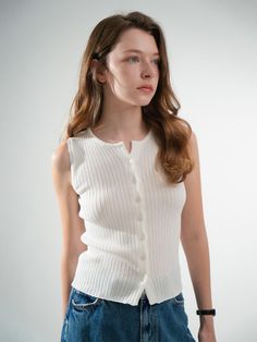 This is a casual and trendy top by VLETI that is made out of high quality and sturdy material. With distinctive mood of the design and comfortable wear, you can style it for your feminine summer outfit.- Round neckline and sleeveless design- Button closure on the front- Trendy and feminine casual mood Chic Knit Tops With Buttons, Casual Sweater Vest With Buttons, Knit Tops With Button Closure For Day Out, Summer Cotton Ribbed Sweater Vest, Summer Tops With Button Closure For Layering, Casual Tank Top With Button Closure, Casual Sweater Vest With Button Closure For Layering, Everyday Ribbed Sleeveless Sweater Vest, Ribbed Sleeveless Sweater Vest For Everyday