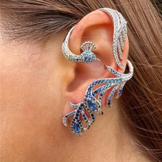 Make A Statement With This Ear Jacket. The Peacock Design Will Definitively Make Your Look Fashionable. The Bottom Of This Ear Wrap Requires Your Ear To Be Pierced But The Top Can Easily Slide On Your Ear. This Is A Single Ear Jacket, It Is Sold As 1 Unit And Doesn't Come As A Pair. This Ear Jacket Can Be Worn Only On The Right Or Left Ear. Material: Sterling Silver Stones: Micro Paved White Simulated Diamonds And Lab Created Emeralds Color: Silver Size Of Earring: Large (Length: 6.5 Cm / 2.5 In Peacock Earrings, Fancy Jewellery Designs, Purple Diamond, Mini Earrings, The Peacock, Peacock Design, Ear Jacket, Fancy Jewellery, Heart Drop Earrings