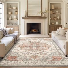 a living room filled with furniture and a fire place in the middle of the room