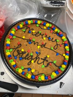 a birthday cake that is on top of a stove with frosting and sprinkles