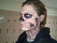 a woman with her face painted to look like a skeleton is shown in this image