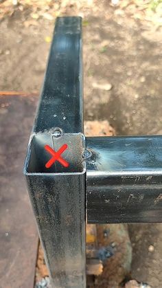 there is a metal object with a red x on it