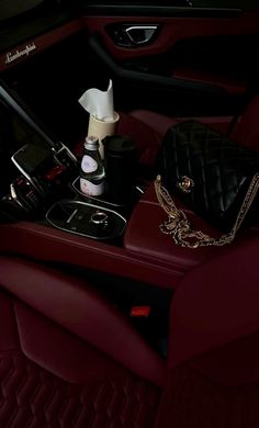 the interior of a car is shown with items on the table and in the center console