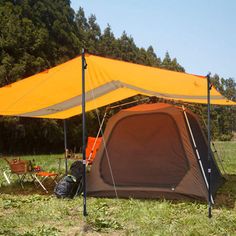 a tent set up in the middle of a field