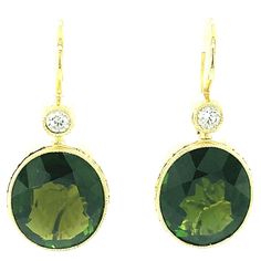 These pretty dangling earrings will add a great finishing touch to any outfit! Large, richly colored, olive green tourmaline ovals are bezel set in 18k yellow gold and dangle from bezel set round sparkling diamonds for a look that transitions beautifully from day to night! Fine 18k yellow gold wires make these earrings super comfortable to wear! Handmade by our Master Jewelers in Los Angeles. Green tourmaline, 12.87 x 10.86mm, 10.12 carats total Round brilliant cut diamonds, .16 carats total Outfit Large, Bezel Set Earrings, Set Earrings, Diamond Dangle Earrings, Dangling Earrings, Gold Wire, Jewellery Design, Green Tourmaline, Sparkle Diamonds