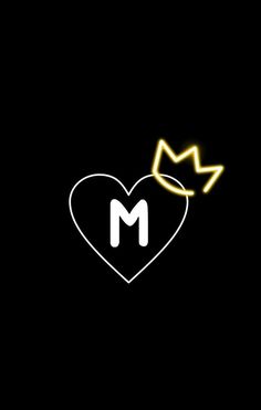 a heart with a crown on it and the letter m in the middle is lit up