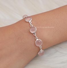 Rose Quartz Bracelet, 925 Sterling Silver Bracelet, January Birthstone, Handmade Bracelet, Adjustable Bracelet, Boho Jewelry, Gift For Women Gemstone - Rose Quartz  Stone Quality - AAA  Weight - 8.28  gm  Stone Length- 0.8 cm, Stone Width - 0.8 cm Bracelet Length - 6 inch to 9 inch sizes are available, we give 0.5 inch adjustable in the size which you order ( NOTE - 0.5 INCH ADJUSTABLE IS INCLUDED IN YOUR ORDERED SIZE ) Stone Shape - As shown in the picture We serve complete 925 sterling silver Jewelry and genuine properties of the stone. The products are dispatched from the small business from UK. Product Quality and Packaging - Our all products are 925 Silver Stamped which shows that the product is genuine and authentic .The products are dispatched from the small business from UK so you Round Rose Quartz Natural Stone Bracelets, Rose Quartz Natural Stones Round Bracelets, Rose Quartz Natural Stones Bracelet, Pink Gemstone Sterling Silver Bracelet, Pink Sterling Silver Jubilee Bracelet, Handmade Silver Rose Quartz Bracelets, Handmade Rose Quartz Silver Bracelets, Round Rose Quartz Gemstone Bracelet, Silver Rose Quartz Bracelet