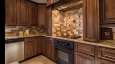 a kitchen with wooden cabinets and tile backsplash