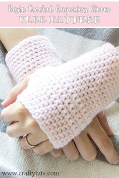 a woman's hand wearing pink crocheted arm warmers