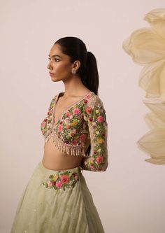 A burst of freshness - that's what this lupin pistachio green lehenga set is all about! Paired with multicolor resham embroidered full sleeves blouse in a monochrome shade, it is the ultimate bridesmaids's dream. The skirt, crafted in organza, features intricate embroidery on circumference part of the lehenga, and is perfect for twirl-ready moments. Also featuring a organza dupatta with the same to go all out with it Green Palazzo Set With Unstitched Blouse For Wedding, Designer Green Palazzo Set With Intricate Embroidery, Green Resham Embroidered Sharara For Spring, Green Palazzo Set With Unstitched Blouse For Reception, Spring Green Sharara With Resham Embroidery, Green Sharara With Resham Embroidery For Spring, Green Resham Embroidery Sharara For Spring, Green Long Sleeve Palazzo Set For Festive Occasion, Green Long Sleeve Anarkali Set With Floral Embroidery