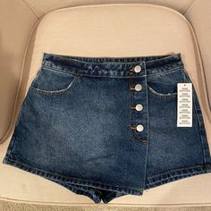 Urban Outfitters Denim Skort. New With Tags. Size 27. Adorable! High Rise Jeans With Pockets By Urban Outfitters, Urban Outfitters High Rise Jeans With Pockets, Urban Outfitters Mid-rise Medium Wash Jeans, Urban Outfitters High Waist Medium Wash Bottoms, Urban Outfitters High-waist Medium Wash Bottoms, Urban Outfitters Denim Blue Bottoms For Spring, Urban Outfitters Mid-rise Denim Blue Jeans, Urban Outfitters High Rise Denim Blue Jeans, Urban Outfitters High Waist Denim Blue Bottoms