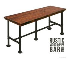 the rustic wood and pipe bar table is shown with black metal pipes on each side