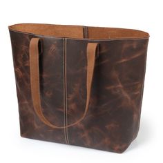 Explore All Tote Bags Specifically Tailored for: Tote Bags Exquisite Top-Grain Cowhide Leather Tote Bag, Handcrafted Durable High-Quality Shoulder Laptop Tote, Women Tote for Toiletries or Electronic Devices Londo Carmel Top-Grain Cowhide Leather Tote BagThe Londo Top-Grain Cowhide Leather Tote Bag is designed and crafted with the purpose of producing a product that is not only a result of top-quality leather craftsmanship but also a convenient and modern accessory that one can rely on. The Lond Leather Makeup Bag, Laptop Tote, Black Leather Tote Bag, Genuine Leather Totes, Modern Accessories, Electronic Devices, Top Grain Leather, Womens Tote, Leather Tote Bag