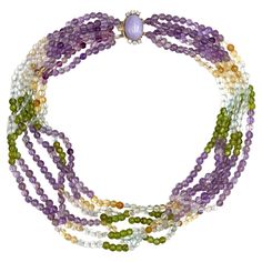 Pre owned vintage estate multi strand necklace consisting of 4.5-5mm beads made of amethyst, citrine, clear quartz and peridot. The clasp is 14K white and yellow gold with one lavender jade measuring 17.5X13.0X7.8mm and six round brilliant-cut diamonds weighing a total approximate weight of 0.36 carat. * Diamonds are I color, VS clarity * Necklace is 17.5 inches long Three Strand Pearl Necklace, Multi Strand Pearl Necklace, Jade Bead Necklace, Lavender Jade, Aquamarine Gemstone, Colourful Necklace, Multi Strand Necklace, Strand Necklace, Round Brilliant Cut Diamond