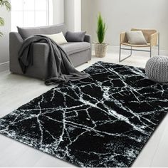 Indulge in the luxury of the plush Marble Elegance Shaggy Area Rug, designed to transform any room with its sophisticated charm and a touch of contemporary flair. This exquisite rug features a unique marble pattern, providing an artistic statement that captures the timeless beauty of natural stone with an urban twist. Crafted from high-grade materials, the rug's 1-inch pile thickness offers an irresistibly soft surface, welcoming bare feet with its warm and shaggy texture. It's not just a treat White Shaggy Rug, Unique Marble, Shaggy Rug, Contemporary Home Decor, Contemporary Home, Exquisite Rugs, Marble Pattern, Floor Decor, Soft Black