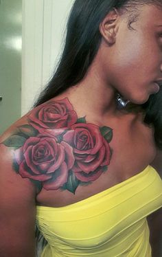 a woman with a rose tattoo on her shoulder