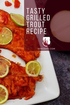 two fish fillets on a white plate with lemons and peppers next to the words tasty grilled trout recipe