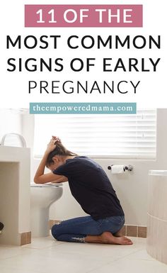 a woman sitting on the floor in front of a toilet with her head in her hands