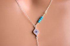 "This is a 925 sterling silver, multi strand Evil Eye Lariat Y style necklace! Genuine turquoise gemstones 3-4mm make this double strand necklace stunning! Necklace has a shorter choker length chain and a longer Y style chain with an evil eye center pendant with small pave blue crystals. A 1\" sterling silver bar pendant with a turquoise gemstone hangs from drop. Drop measures 3\" with bar pendant.ds This is stunning statement piece, makes a great gift for that unique lady! Comes nicely boxed, f Blue Sterling Silver Lariat Necklace Gift, Blue Sterling Silver Lariat Jewelry, Blue Sterling Silver Lariat Necklace, Elegant Blue Sterling Silver Lariat Necklace, Lariat Necklaces, 14kt Gold Jewelry, Necklaces Blue, Eye Center, Clean Sterling Silver