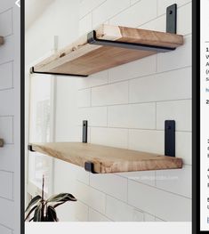 two wooden shelves are hanging on the wall