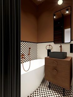 a bathroom with black and white checkered tile on the floor, walls, and bathtub