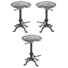 three metal stools sitting next to each other