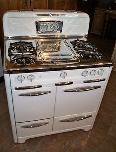 an old fashioned stove with two ovens on it's sides and no burners