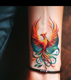 a woman's wrist with a colorful bird tattoo on it