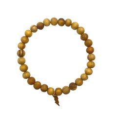 This stretchy bracelet is consciously handmade with Ethically Sourced Palo Santo beads from Peru (Brusera Graveolens), and a 18KT gold plated thunderbolt charm. Meaning: Palo Santo is an aromatic and sacred wood from Peru. Properties: Cleansing & therapeutic healing power. Inspired creativity & clears all negative energy. Chakra: Third eye Bracelet Diameter: 7 1/4" Wood Beads: 6mm Materials: Palo Santo Wood Beads / 18KT gold plated charm over sterling silver. Our beads and Palo Santo sti Palo Santo Wood, Aura Healing, Healing Power, Eye Bracelet, Stretchy Bracelets, Healing Powers, Negative Energy, Different Shapes, Third Eye