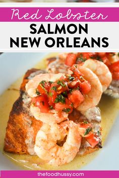 the red lobster is served on toasted bread with tomatoes and shrimp