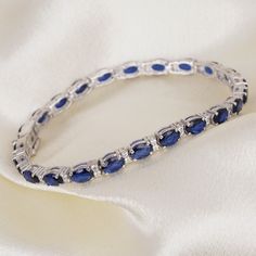 Blue Sapphire Bracelet, Diamond Bracelet, Tennis Bracelet, Gemstone Bracelet, Wedding Engagement Bracelet, Gift For Her, Party Wear Bracelet. Blue Sapphire bracelet diamond looks western and stylish modular design bracelet is make in 925 sterling silver base metal . all types of customization are available we can customize these as per the requirements also . These blue sapphire and white diamond is a suitable for all types of skin tones . also you can wear these as per your any outfits . specia Sapphire Round Bracelets For Wedding, Sapphire Wedding Bracelets, Fine Jewelry Sapphire Bangle Bracelet, Adjustable Sapphire Bracelets For Wedding, Gemstone Tennis Bracelet For Wedding, Wedding Gemstone Tennis Bracelet, Wedding Sapphire Diamond Bracelet With 17 Jewels, Blue Diamond Wedding Bracelet, Blue Jubilee Bracelet Jewelry For Wedding