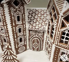 some very pretty looking gingerbread houses made to look like they have been cut out