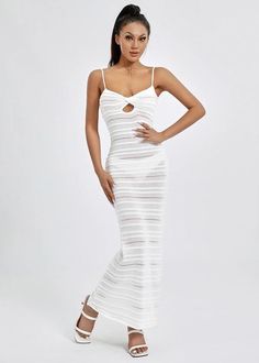 Expertly crafted for comfort and style, our Striped Knitted Cami Maxi Dress is a must-have addition to any wardrobe. With its timeless striped pattern and lightweight fabric, this dress is perfect for any occasion. Its classic white color adds a touch of elegance, making it a versatile and chic choice for any fashion-forward individual. Fabric: High Stretch Material: Polyester Fiber Chic White Knit Midi Dress, Chic White Ribbed Midi Dress, Elegant White Knit Midi Dress, Ribbed Midi Dress For Vacation, Elegant Knit Midi Dress For Vacation, White Ribbed Midi Dress For Party, White Ribbed Knit Dress, Chic White Knit Dress, Spring White Ribbed Midi Dress