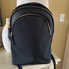 Pristine Condition, Never Used Just Sitting In A Closet. Stylish Triple Zipper Backpack, Perfect For Every Day Use And Travel. Lightweight Waterproof Fabric, And Lining To Keep All Your Stuff Dry Zippers Glide, Smooth, And Easily Breathable Back Panel And Ergonomic Padded Shoulder Straps For Comfort Details & Dimensions 11.6” Width X 17.3” High X 3.9” Deep Capacity 13l Weight 2.4 Lbs Laptop Pocket 14.2” X 10.2” Fits Up To 16” Macbook Elegant Black Backpack With Adjustable Strap, Black Office Backpack, Elegant Black Backpack For Everyday Use, Elegant Black Backpack For Daily Use, Elegant Black Office Backpack, Elegant Black Backpack With Detachable Strap, Black Backpack With Zipper Closure For Office, Elegant Backpack With Zipper Closure, Black Office Backpack With Zipper Closure