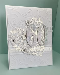 a close up of a greeting card with the number 60 on it's side