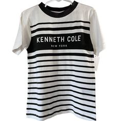 Kenneth Cole New York T-Shirt Boys Size 5 In White And Charcoal, Nwt 100% Cotton Striped Cotton Shirt With Graphic Print, Striped Short Sleeve T-shirt With Letter Print, Striped Short Sleeve Tops With Letter Print, Retro Crew Neck Tops With Name Print, Retro Cotton T-shirt With Name Print, Striped Shirt With Graphic Print And Crew Neck, Striped Crew Neck Shirt With Graphic Print, Striped Crew Neck Top With Logo Print, Striped Graphic Print Crew Neck Shirt