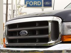 the front end of a black ford truck