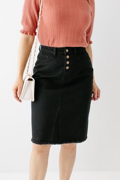 Classic with a hint of vintage. The well-loved 'Haven' skirt is here in a solid black denim wash with the same great details! Created with an A-line design, this skirt works well for a variety of body types. Tuck in a retro graphic tee to get the high waisted effect or pair with a chunky sweater for the perfect cozy vibes. You'll be reaching for this versatile denim skirt in every season! 100% Cotton Machine Wash Cold Do Not Bleach Tumble Dry Low Iron Low Heat Do Not Dry Clean Model Height 5'7" Black Denim Skirt Outfit, Knee Length Denim Skirt, Denim Skirts Knee Length, Black Jean Skirt, Denim Skirt Outfits, Retro Graphic Tees, Black Denim Skirt, Knee Skirts, Floral Print Skirt