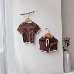 Get ready for some serious baby cuteness with our Textured Knit Set! The textured fabric adds a playful touch to this short sleeve top and matching shorts. Plus, the drawstring waist ensures the perfect fit for your little one. Cute and comfy, it's a must-have for any trendy baby (or their stylish parents)! Cute Brown Tops For Playwear, Cute Brown Tops For Playtime, Cute Knit Tops For Playtime, Casual Knit Tops For Playtime, Kid Outfits, Trendy Baby, Pullover Shirt, Textured Knit, Knit Set